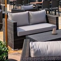 Product photograph of Arlo Rattan Outdoor 2 Seater Sofa With Light Grey Cushions In Brown from Furniture in Fashion