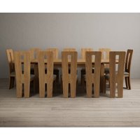 Product photograph of Extending Buxton 180cm Solid Oak Dining Table With 12 Black Lucca Chairs from Oak Furniture Superstore