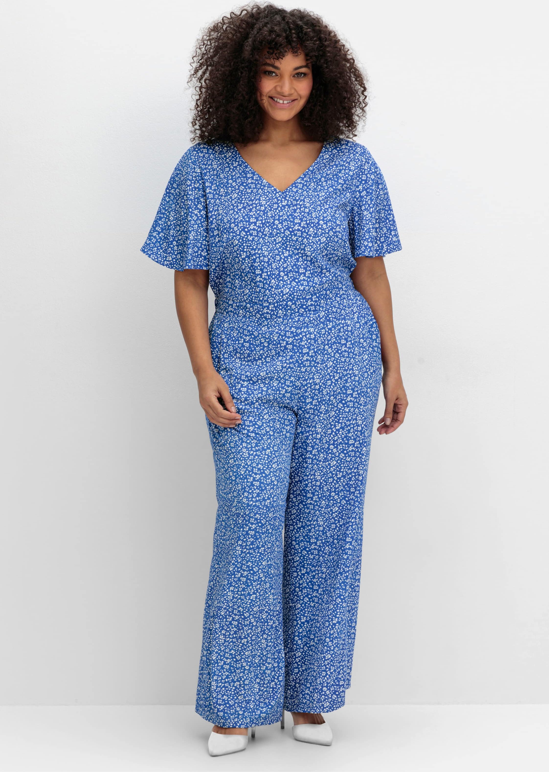 Sheego Jumpsuit mit Millefleurs-Print