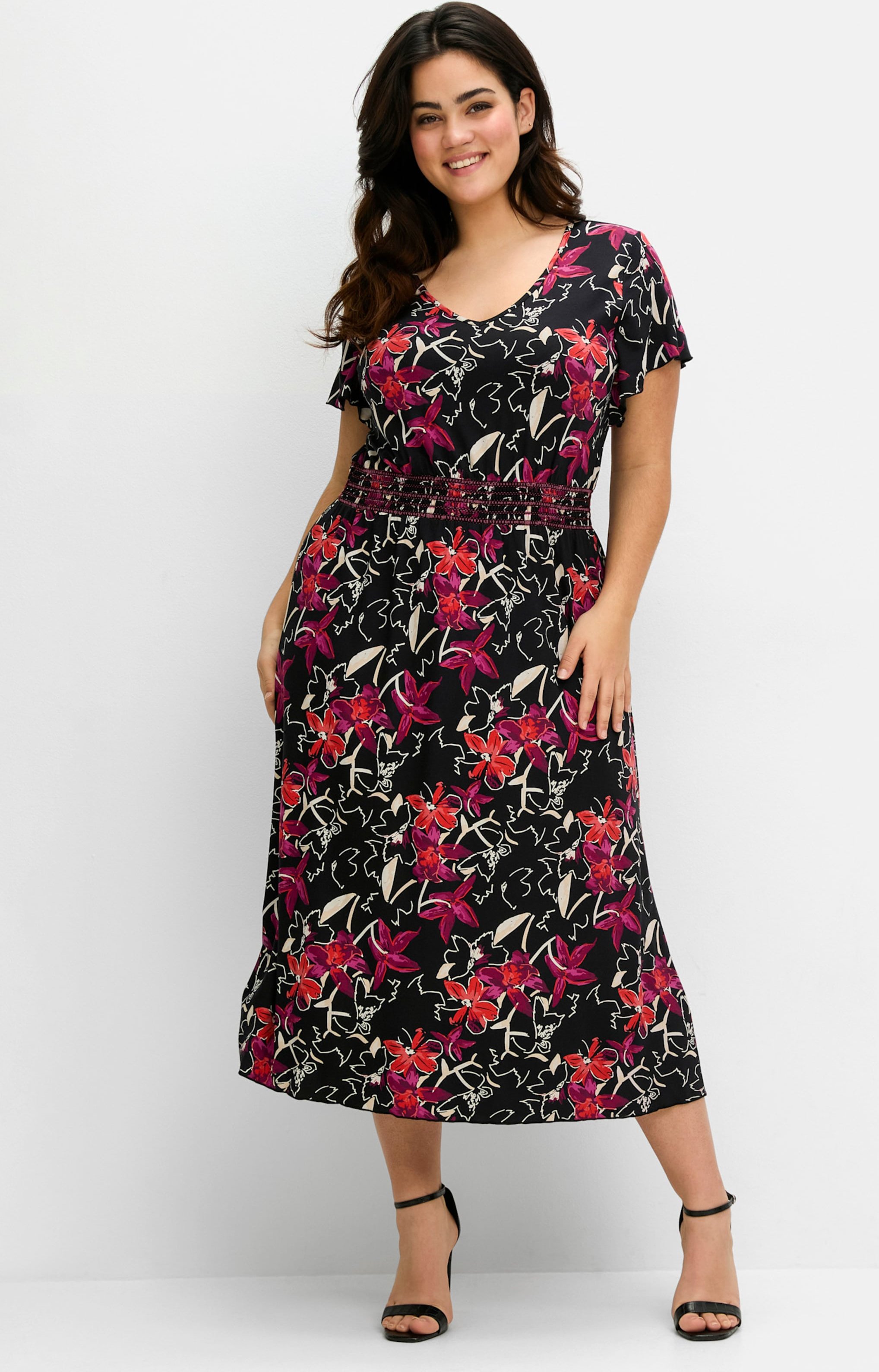 Sheego Jerseykleid mit Zierbändern im Rücken.