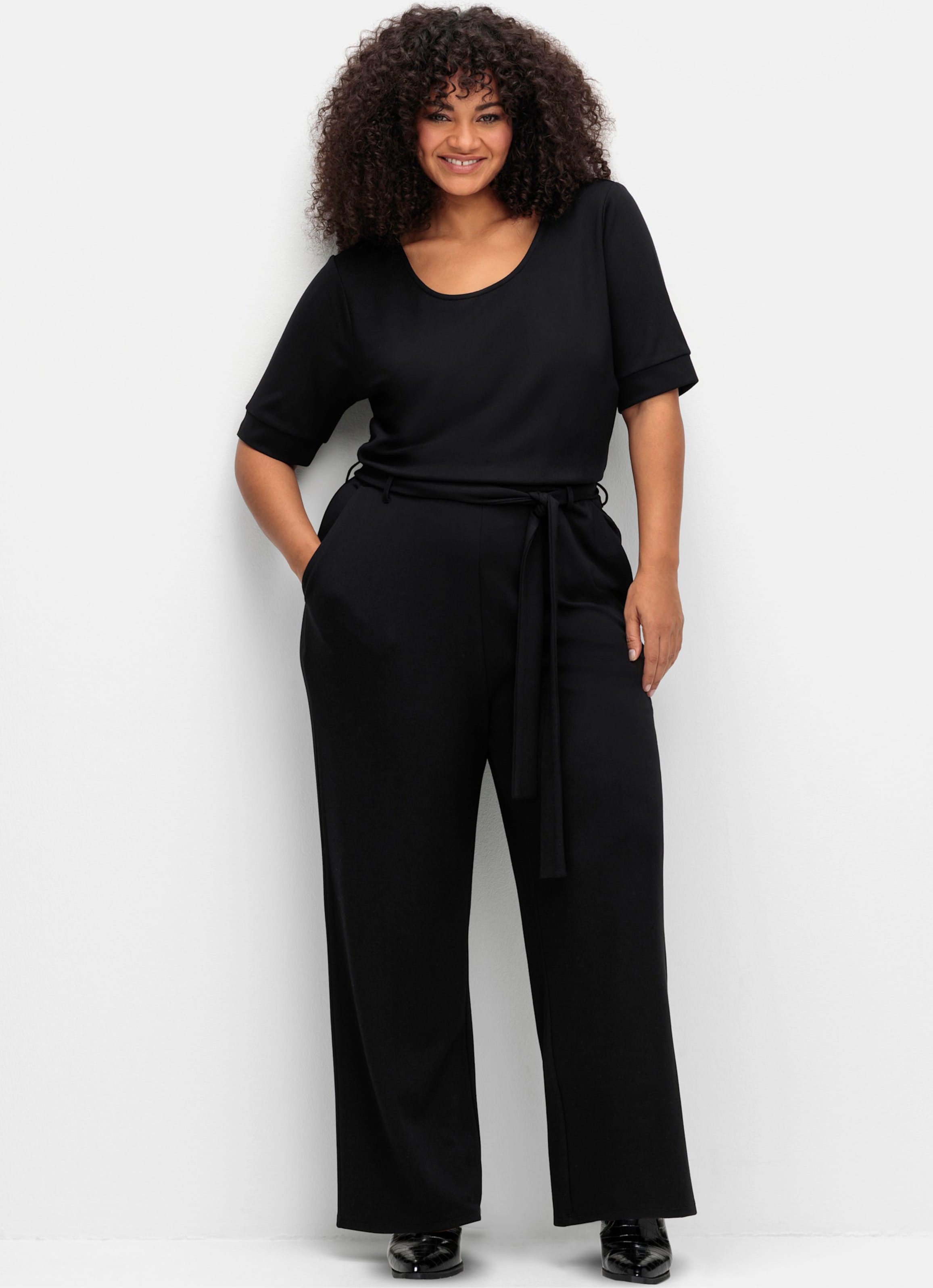 Sheego Jumpsuit mit weitem Bein und Bindegürtel