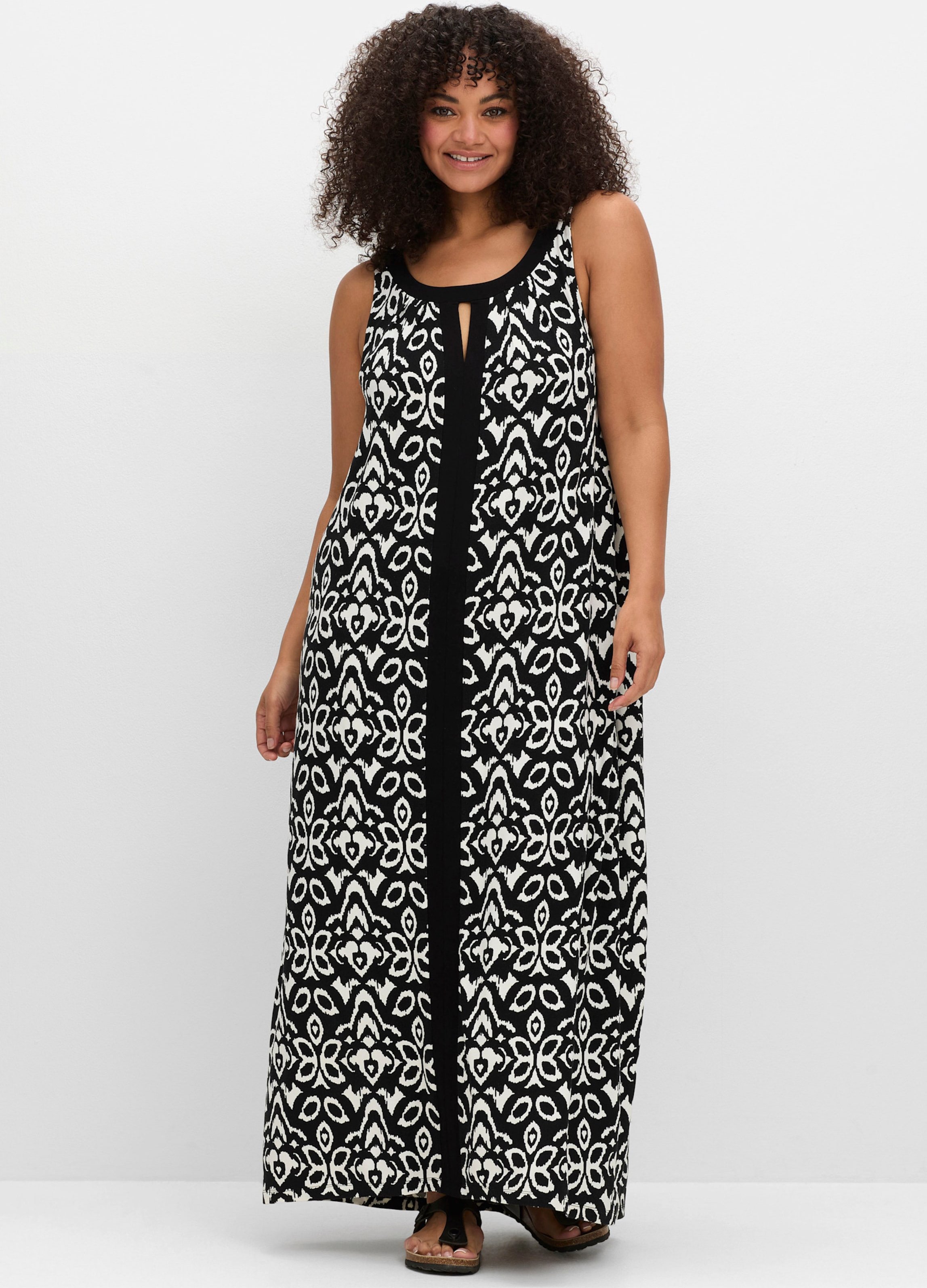 Sheego Jerseykleid mit Ornamentdruck und Cut-outs