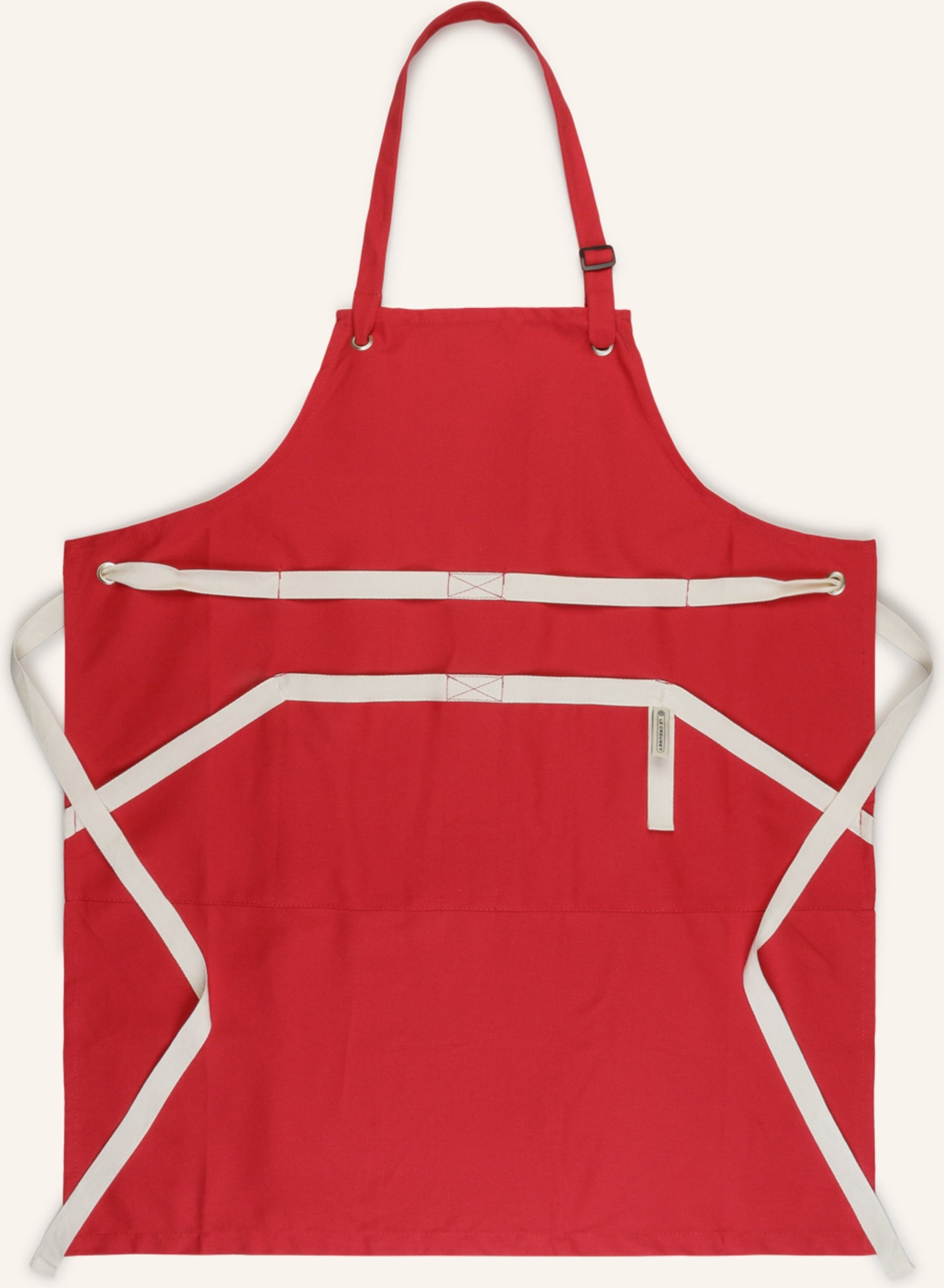 Le Creuset Schürze rot