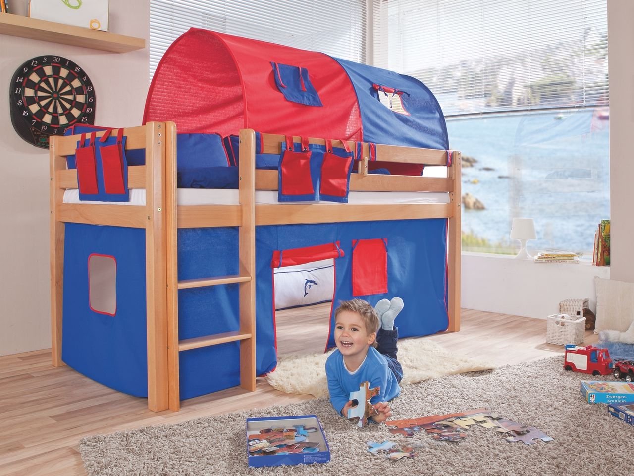 Halbhohes Spielbett ALEX Buche massiv natur lackiert mit Stoffset blau/rot