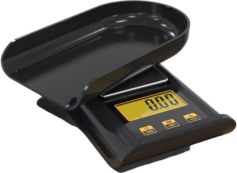 Mini balance électronique avec petit écran LCD, idéale pour peser des articles en cuisine.