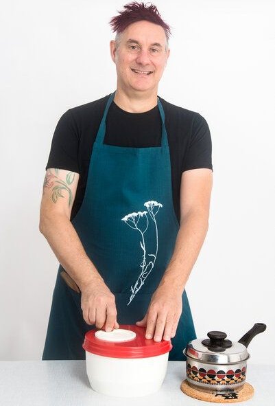 Hirschkind Bio-Kochschürze "Schafgarbe" handgewebt petrol Fair-Trade