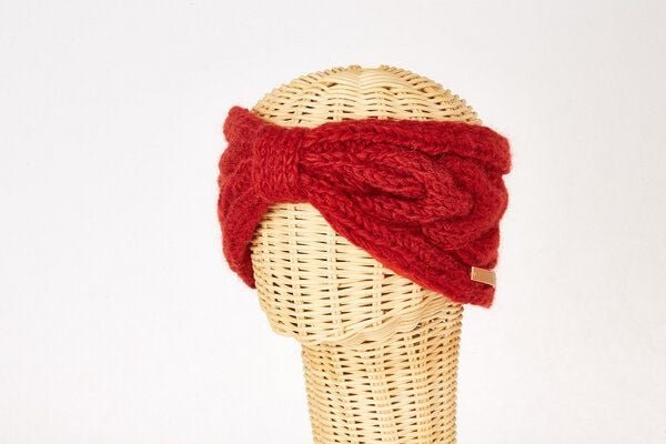 short'n'pietz Schurwollstirnband mit Zopfmuster und Knoten, handgestrickt