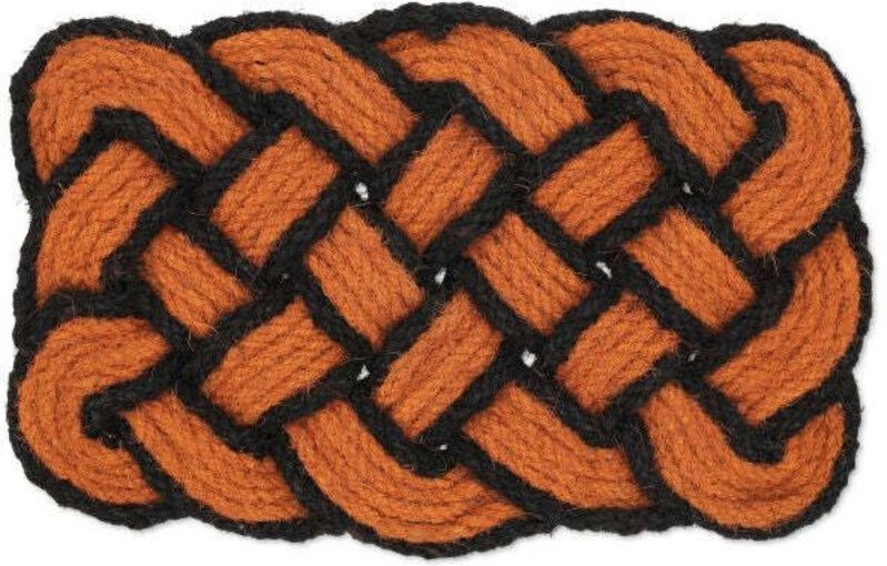 Knotted orangeblack coir rug