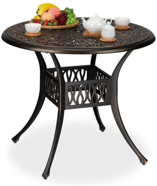 Antiker gartentisch mit schirmloch