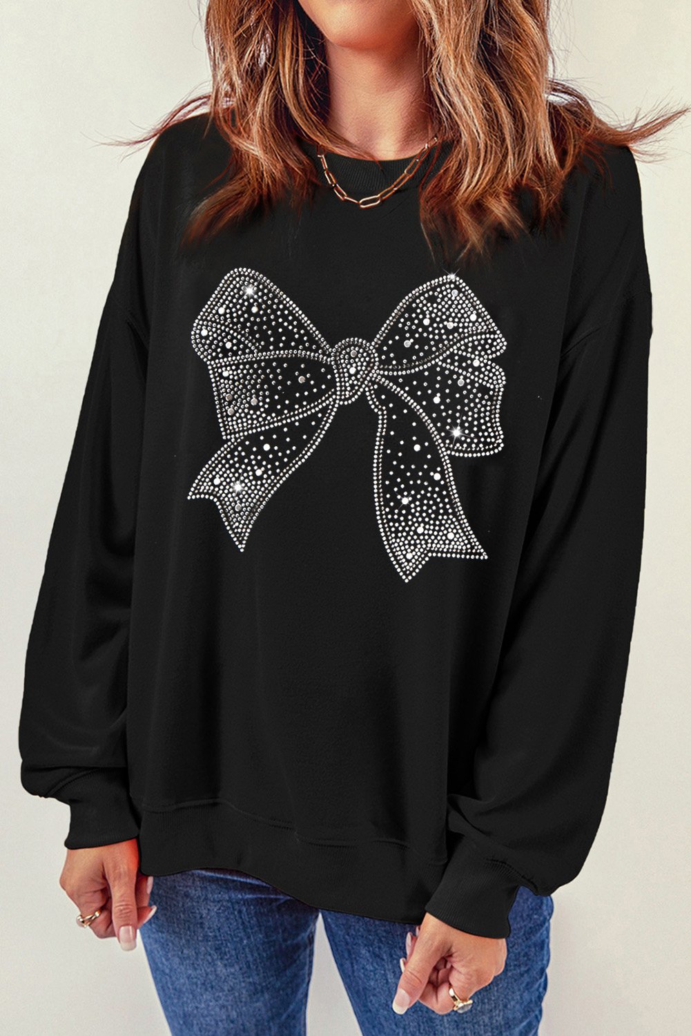 Thumbnail - Schwarzes Rhinestone-Schleifen-Grafik-Sweatshirt mit Rundhalsausschnitt