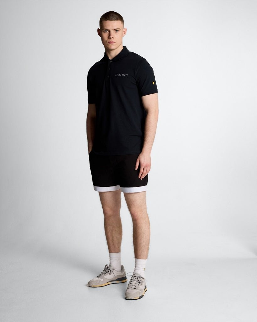 Thumbnail - Lyle & Scott Badeshorts mit Kontrastsaum – Tiefschwarz/Seidenhonig