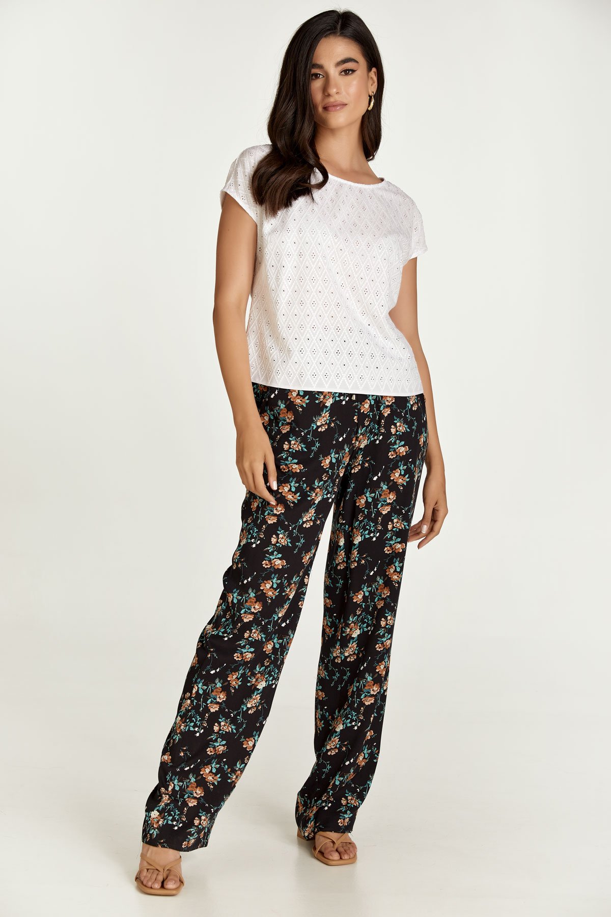 Schwarze geblümte Hose mit weitem Bein