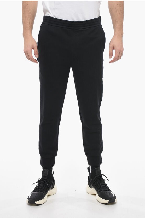 Skinny Fit Sweatpants aus Baumwolle mit Bündchen in Schwarz