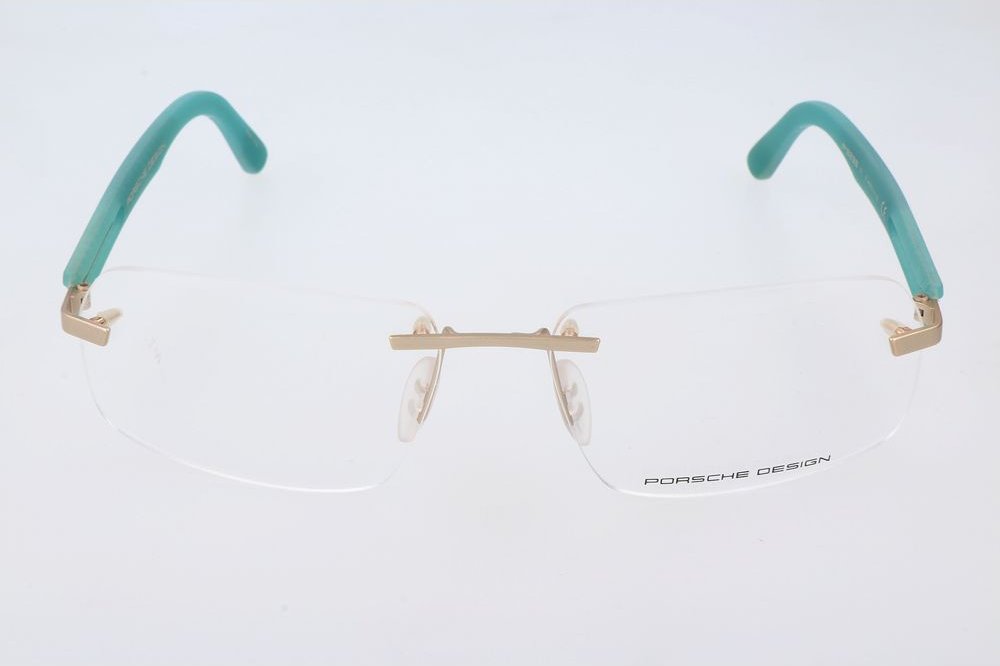 Randlose Brille mit türkisfarbenen Acetatbügeln