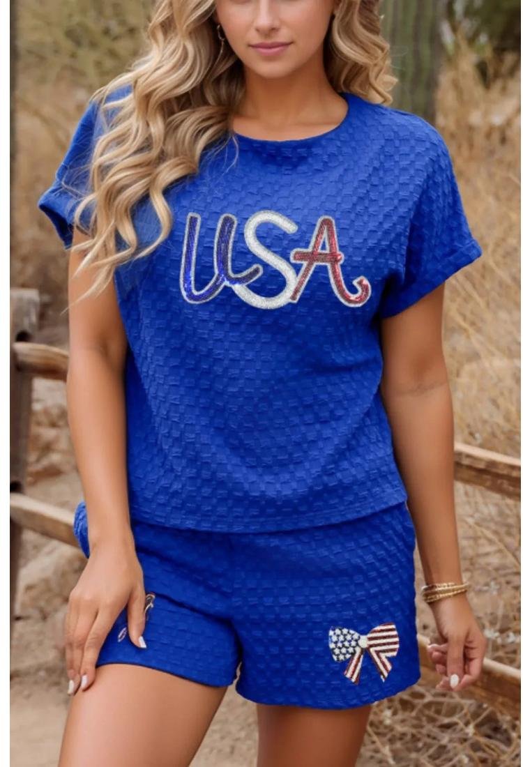 Thumbnail - Damen-Top mit Struktur und Pailletten und Shorts mit Schleife Set