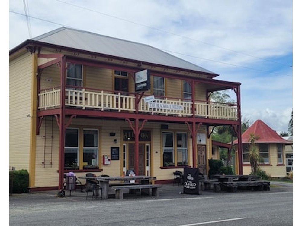 Cosie Miners cottage in historic blackball surrounded by the Paparoa ranges
