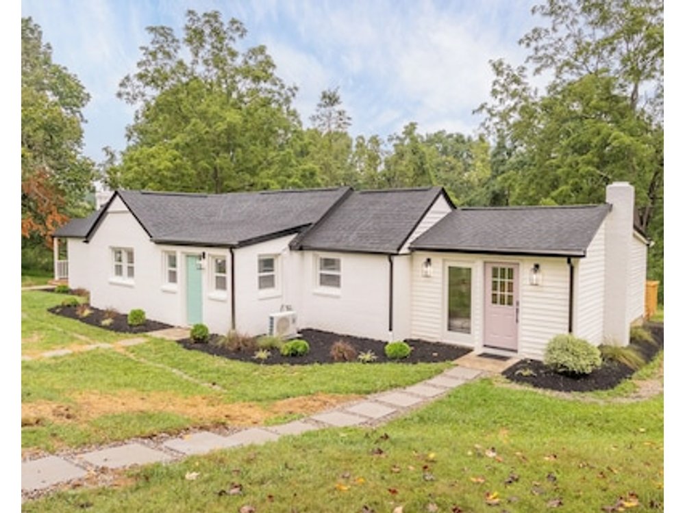 Charming Entry And Spacious Back Deck Surrounded By Nature Perfect For A Peaceful Getaway.