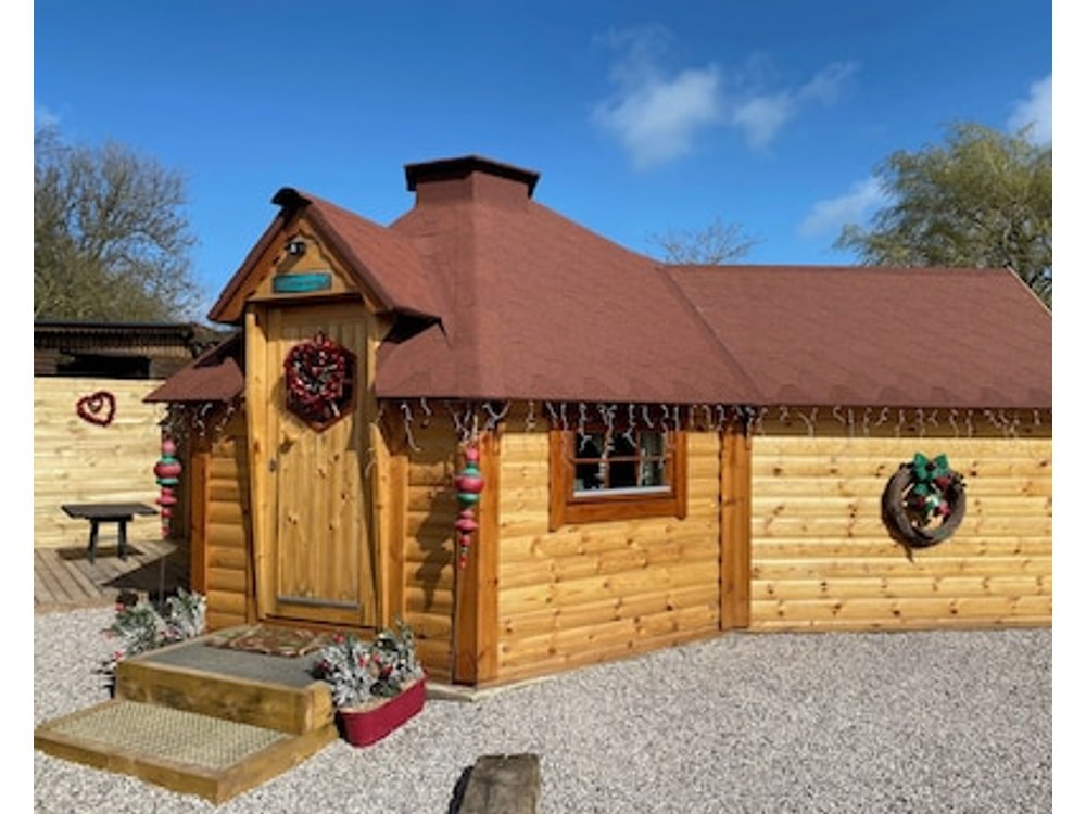 Santa Kota Christmas cottage unusual cottage with animals in the countryside