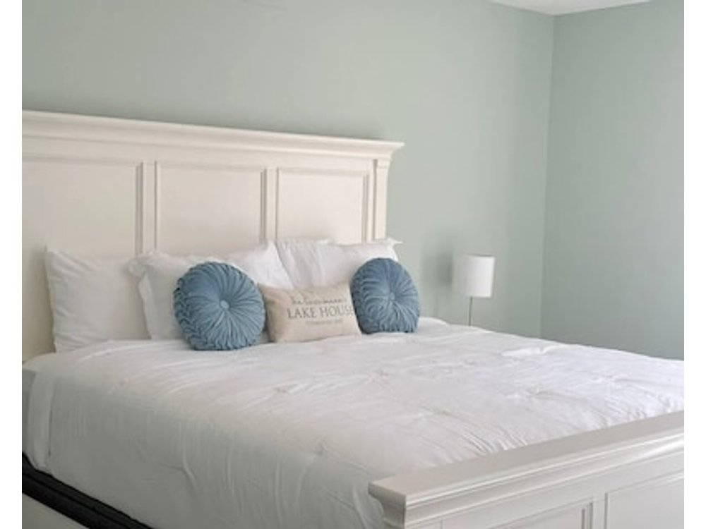 Shore Thing Getaway is a stunning Lake of the Ozarks lakefront home with 3 bedrooms 2.5 baths gourmet kitchen private dock kayaks firepit & grill