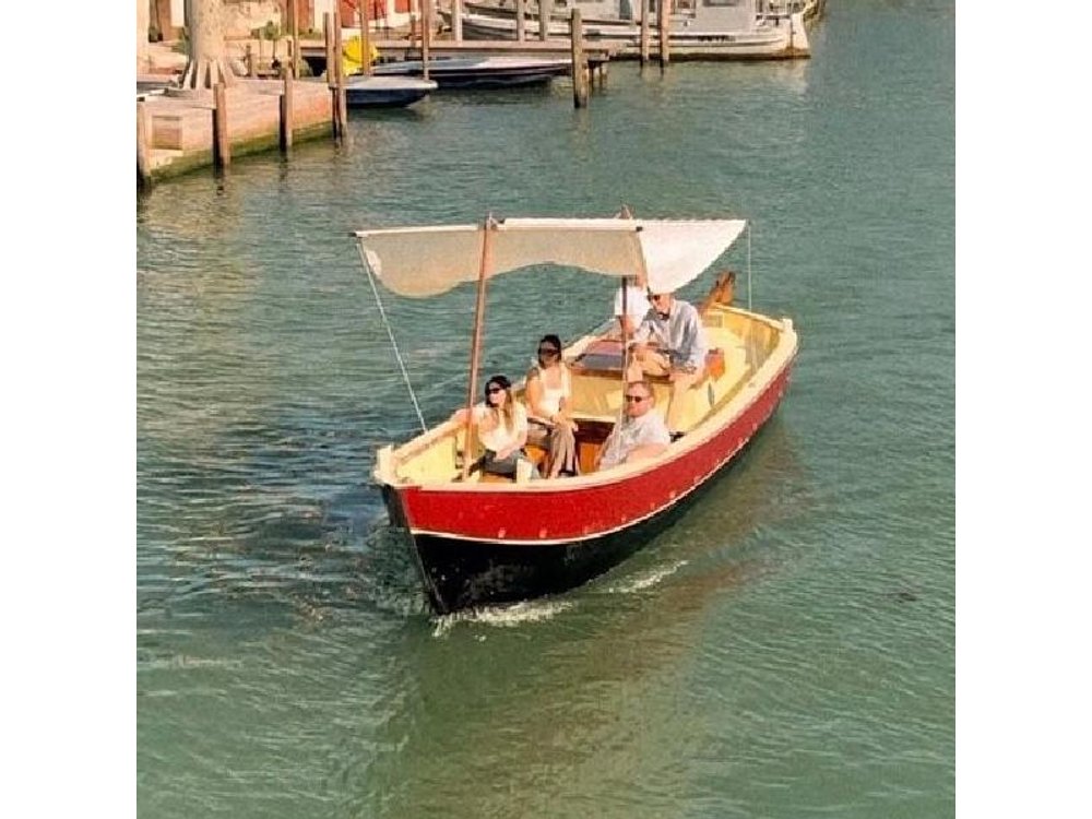 Sunset in a Typical Boat in Venice