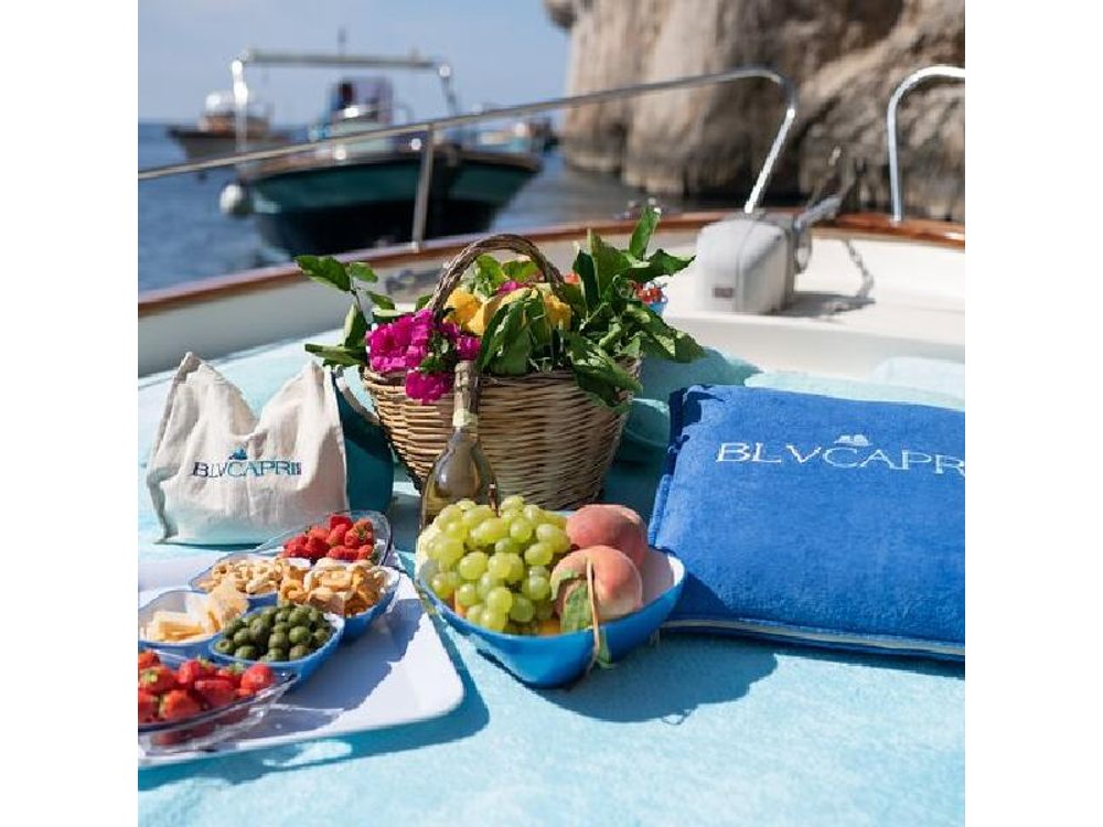 Private Gozzo Boat Tour of Capri with Swim and Local Delicacies