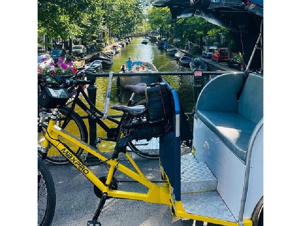 Explore Amsterdam in 75 Minutes – Pedicab Rickshaw City tour