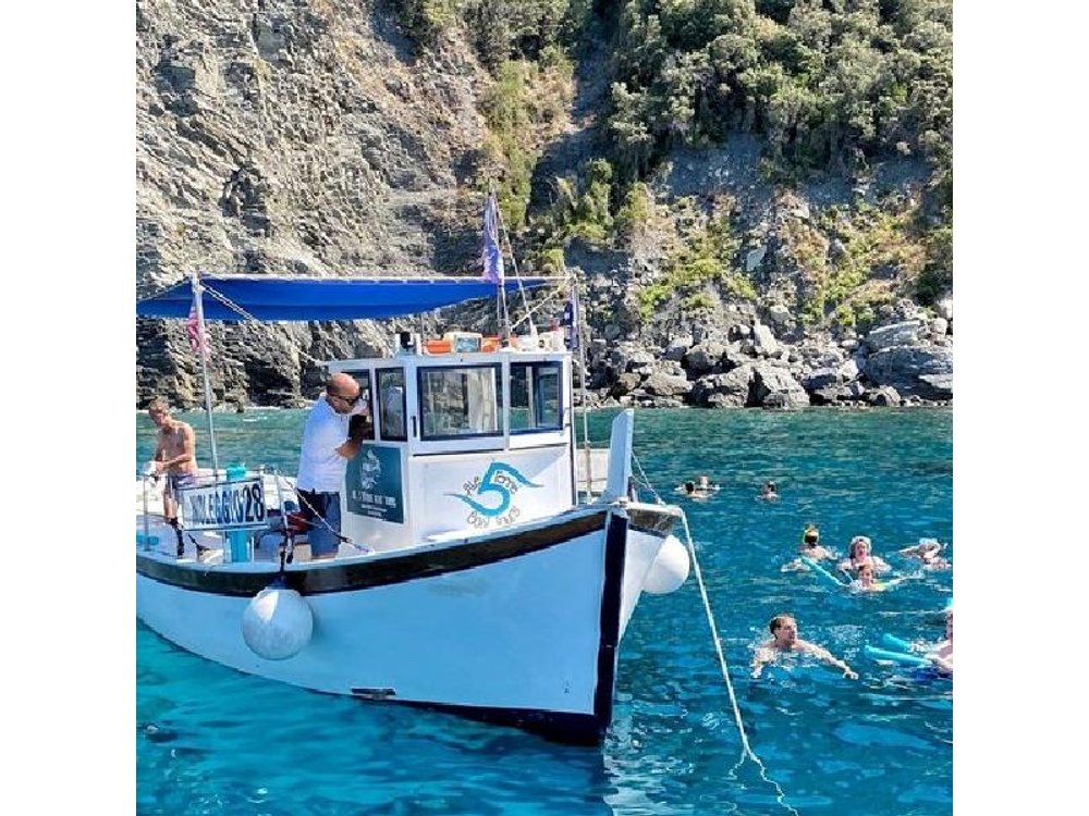 Cinque Terre daytime boat tour with a traditional ligurian gozzo