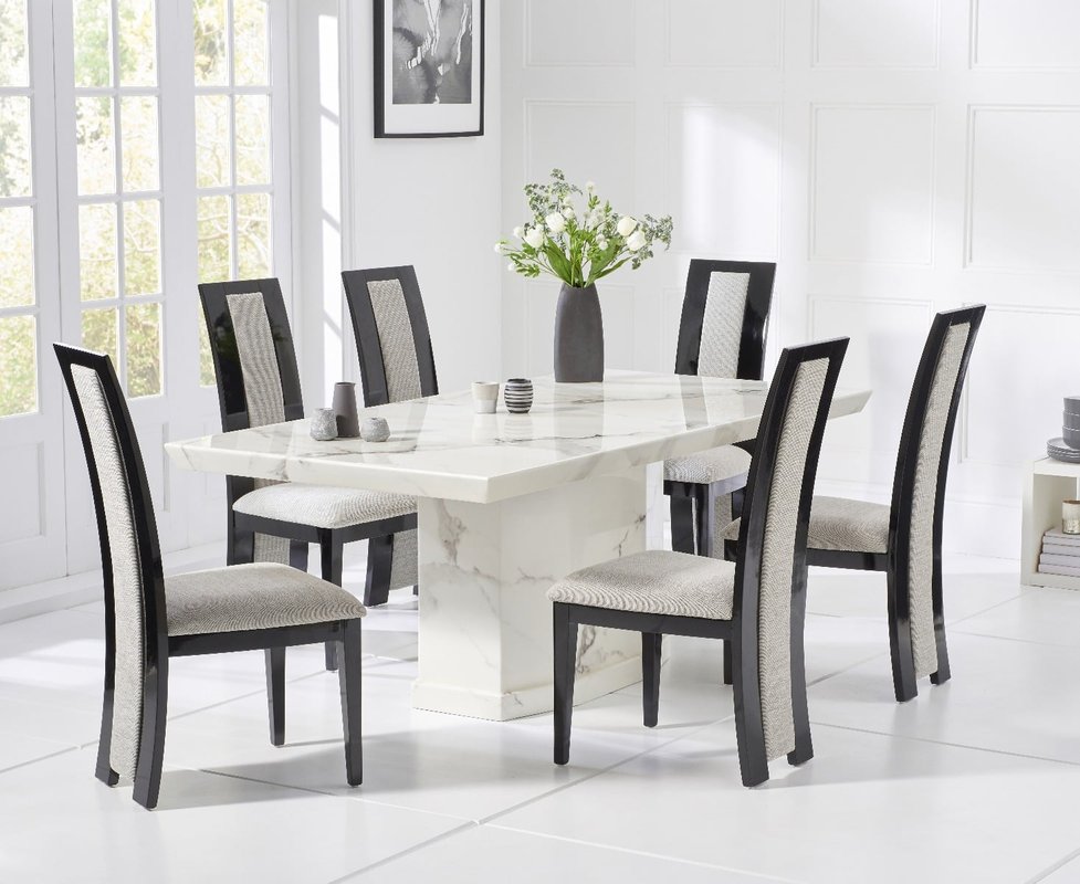 Photo of Carvelle 200cm white pedestal marble dining table with 12 brown novara chairs Photo of Carvelle 200cm white pedestal marble dining table with 12 brown novara chairs