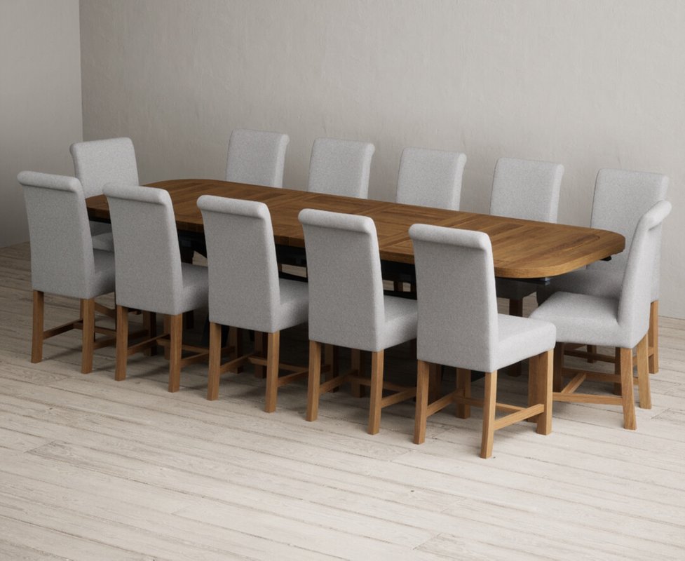 Photo 1 of Extending olympia 180cm oak and dark blue dining table with 12 grey braced chairs Photo 1 of Extending olympia 180cm oak and dark blue dining table with 12 grey braced chairs