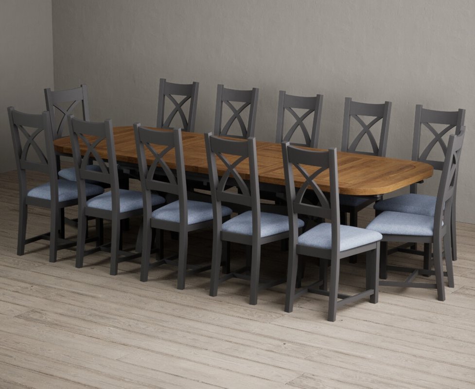 Photo of Extending olympia 180cm oak and charcoal grey dining table with 12 blue painted chairs Photo of Extending olympia 180cm oak and charcoal grey dining table with 12 blue painted chairs