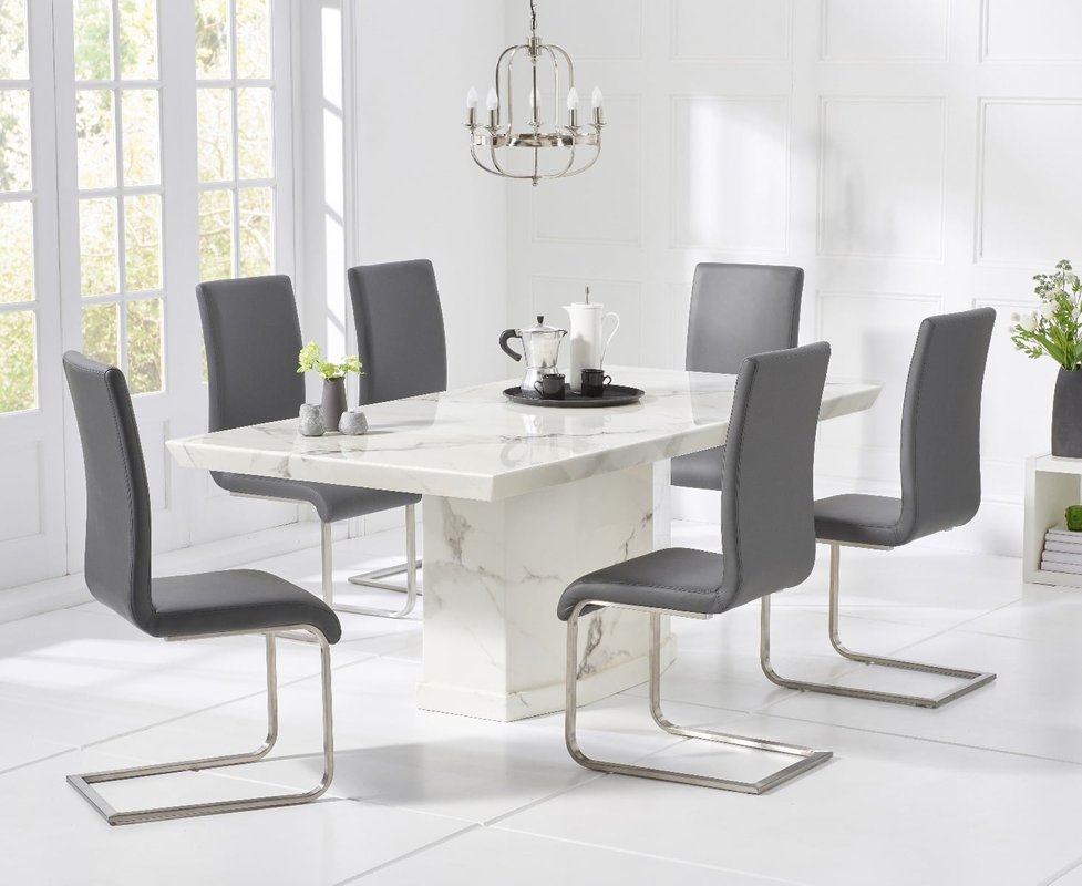 Photo of Carvelle 200cm white pedestal marble dining table with 10 black austin chairs Photo of Carvelle 200cm white pedestal marble dining table with 10 black austin chairs