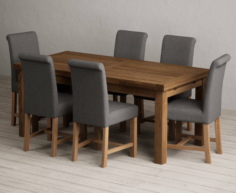 Photo of Extending buxton 180cm rustic solid oak dining table with 12 blue braced chairs Photo of Extending buxton 180cm rustic solid oak dining table with 12 blue braced chairs
