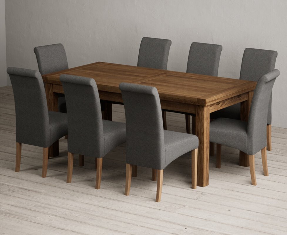 Photo of Extending buxton 180cm rustic solid oak dining table with 8 charcoal grey scroll back chairs Photo of Extending buxton 180cm rustic solid oak dining table with 8 charcoal grey scroll back chairs