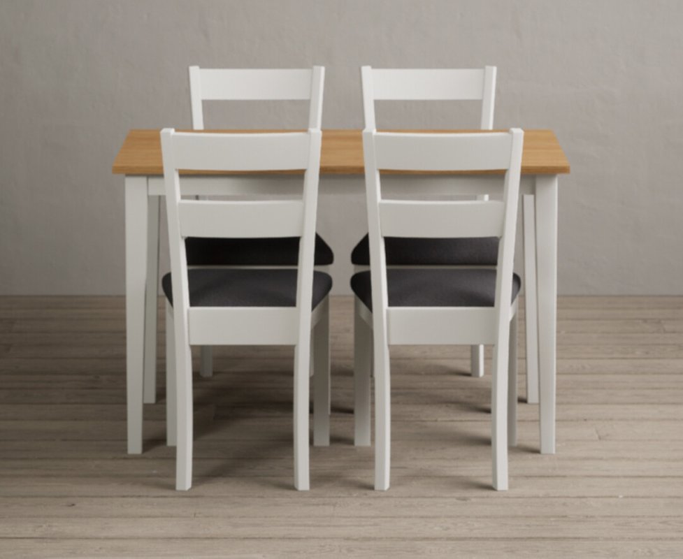 Photo of Kendal 115cm solid oak and signal white painted dining table with 4 blue kendal chairs Photo of Kendal 115cm solid oak and signal white painted dining table with 4 blue kendal chairs