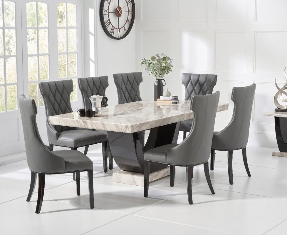 Photo of Novara 200cm cream and black pedestal marble dining table with 12 grey sophia chairs Photo of Novara 200cm cream and black pedestal marble dining table with 12 grey sophia chairs