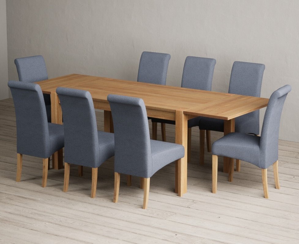 Photo 1 of Extending thetford 150cm solid oak dining table with 8 blue scroll back chairs Photo 1 of Extending thetford 150cm solid oak dining table with 8 blue scroll back chairs