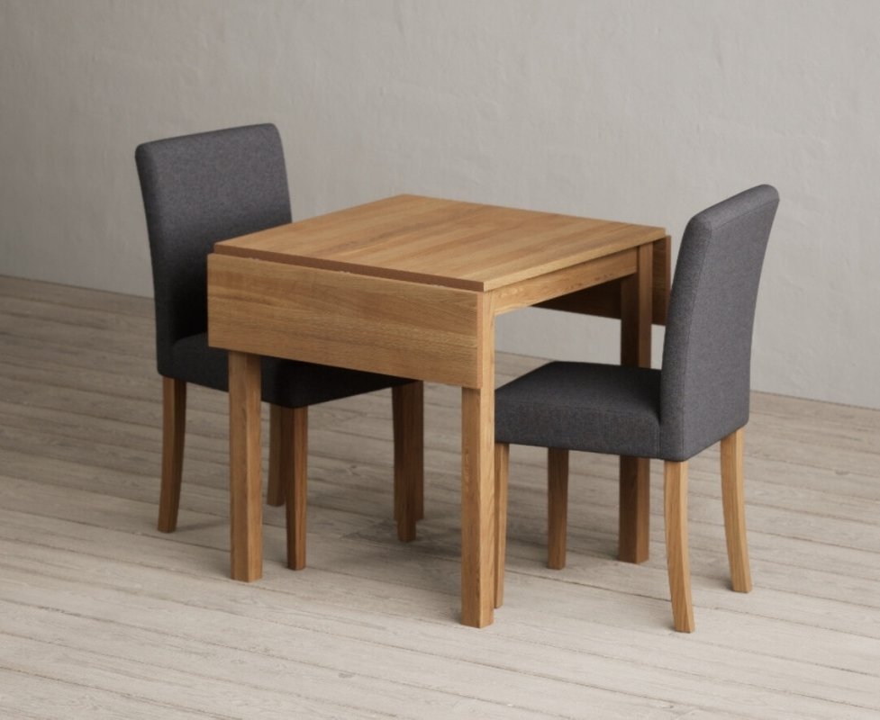 Photo 1 of Extending york 70cm solid oak dining table with 2 charcoal lila chairs Photo 1 of Extending york 70cm solid oak dining table with 2 charcoal lila chairs
