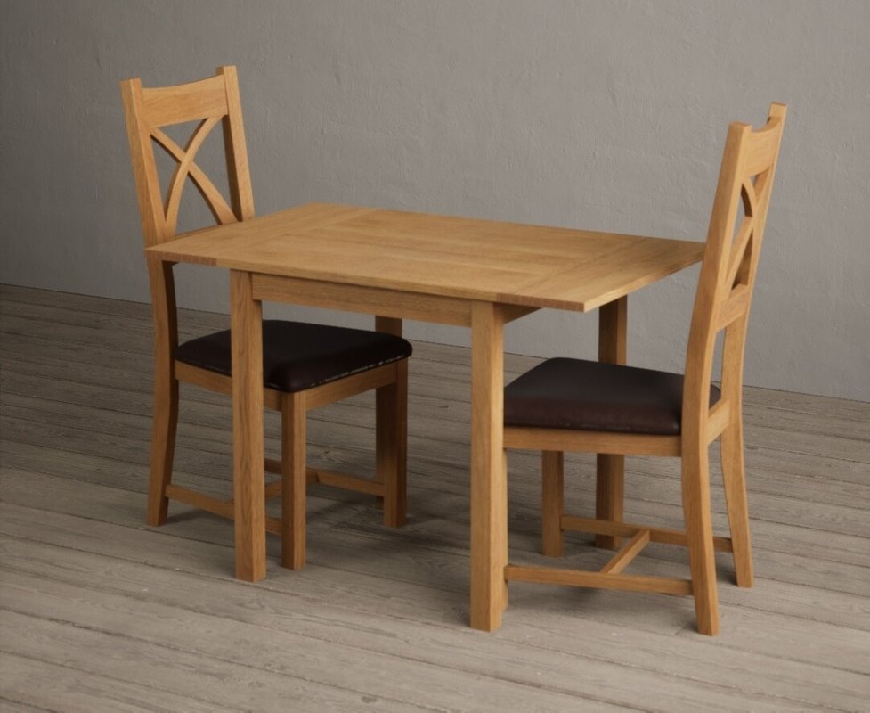Photo 1 of Extending york 70cm solid oak dining table with 2 brown natural solid oak chairs Photo 1 of Extending york 70cm solid oak dining table with 2 brown natural solid oak chairs