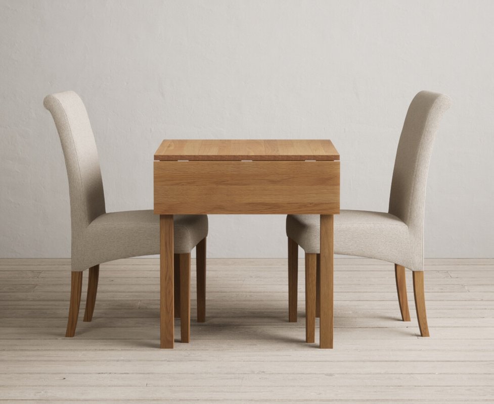 Photo 1 of Extending york 70cm solid oak dining table with 2 natural scroll back chairs Photo 1 of Extending york 70cm solid oak dining table with 2 natural scroll back chairs