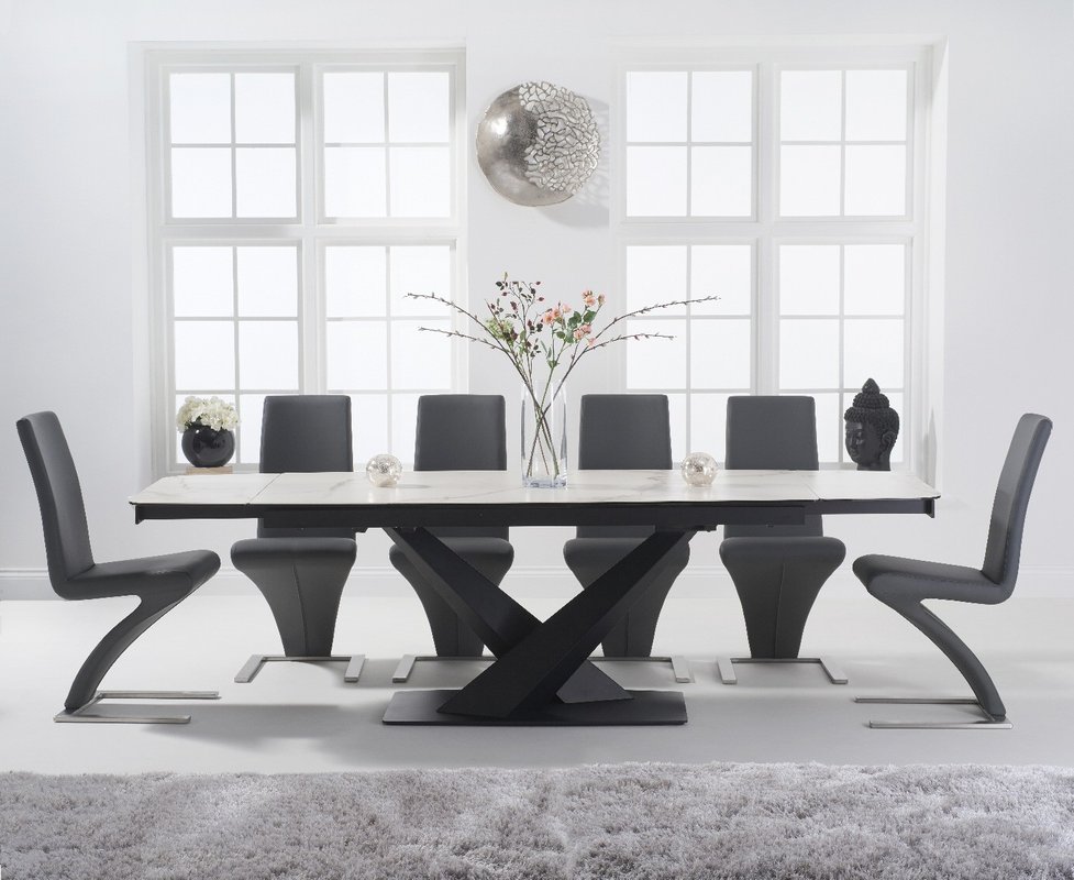 Photo of Extending jacob 180cm white ceramic dining table with 12 black aldo chairs Photo of Extending jacob 180cm white ceramic dining table with 12 black aldo chairs