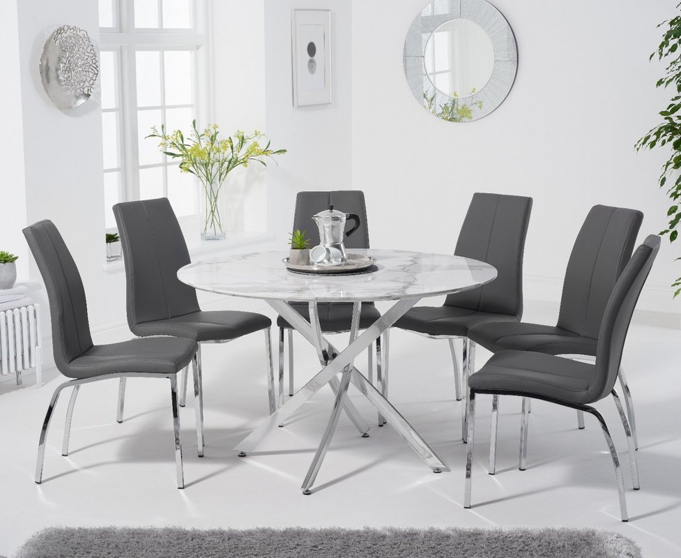 Photo of Comiso 120cm round white marble dining table with 6 white marco chairs Photo of Comiso 120cm round white marble dining table with 6 white marco chairs
