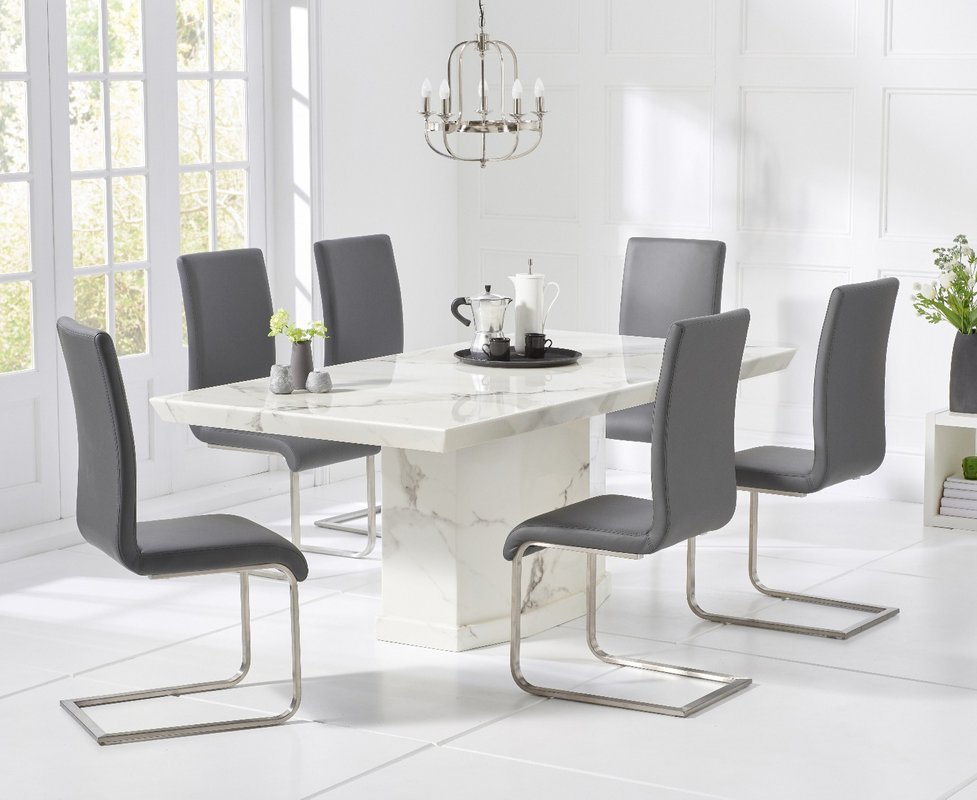 Photo of Carvelle 200cm white pedestal marble dining table with 10 white austin chairs Photo of Carvelle 200cm white pedestal marble dining table with 10 white austin chairs