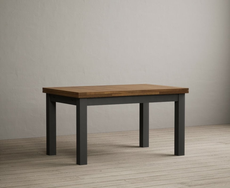 Photo of Extending buxton 140cm oak and charcoal grey painted dining table Photo of Extending buxton 140cm oak and charcoal grey painted dining table