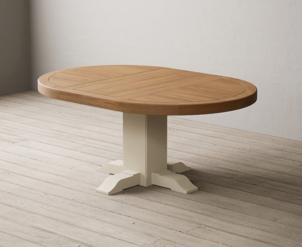 Photo of Extending helmsley oak and cream painted pedestal dining table Photo of Extending helmsley oak and cream painted pedestal dining table