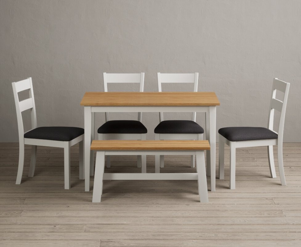 Photo of Kendal 115cm solid oak and signal white painted dining table with 2 blue kendal chairs with 1 oak and white bench Photo of Kendal 115cm solid oak and signal white painted dining table with 2 blue kendal chairs with 1 oak and white bench