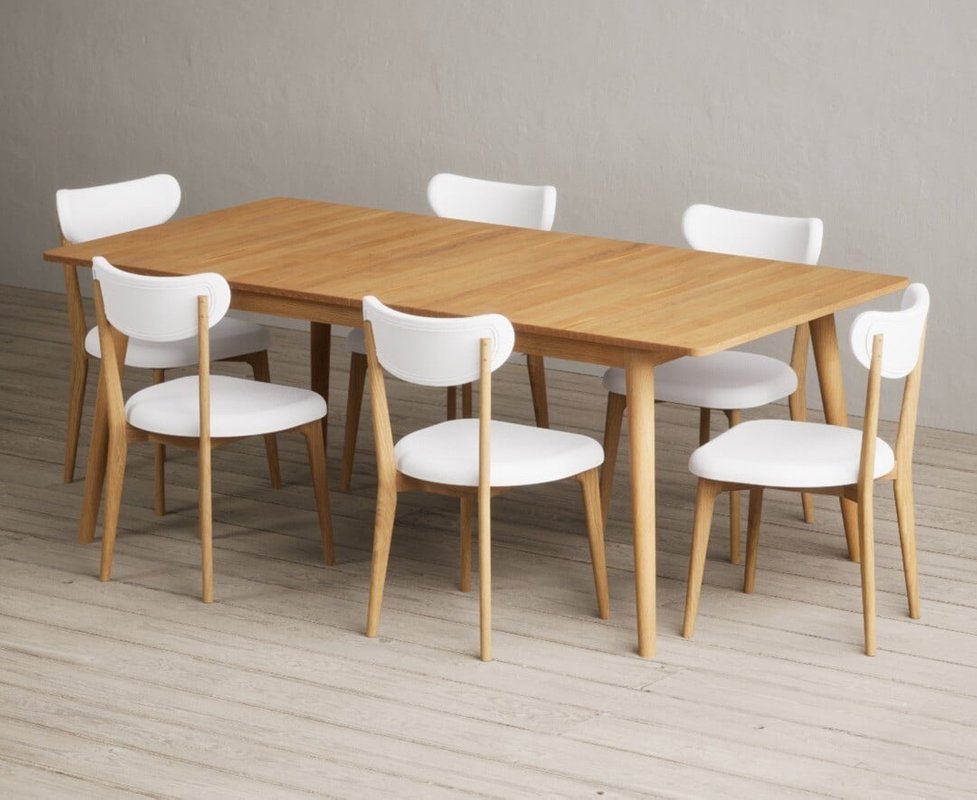 Photo of Extending ruben 200cm retro oak dining table with 10 white nordic chairs Photo of Extending ruben 200cm retro oak dining table with 10 white nordic chairs