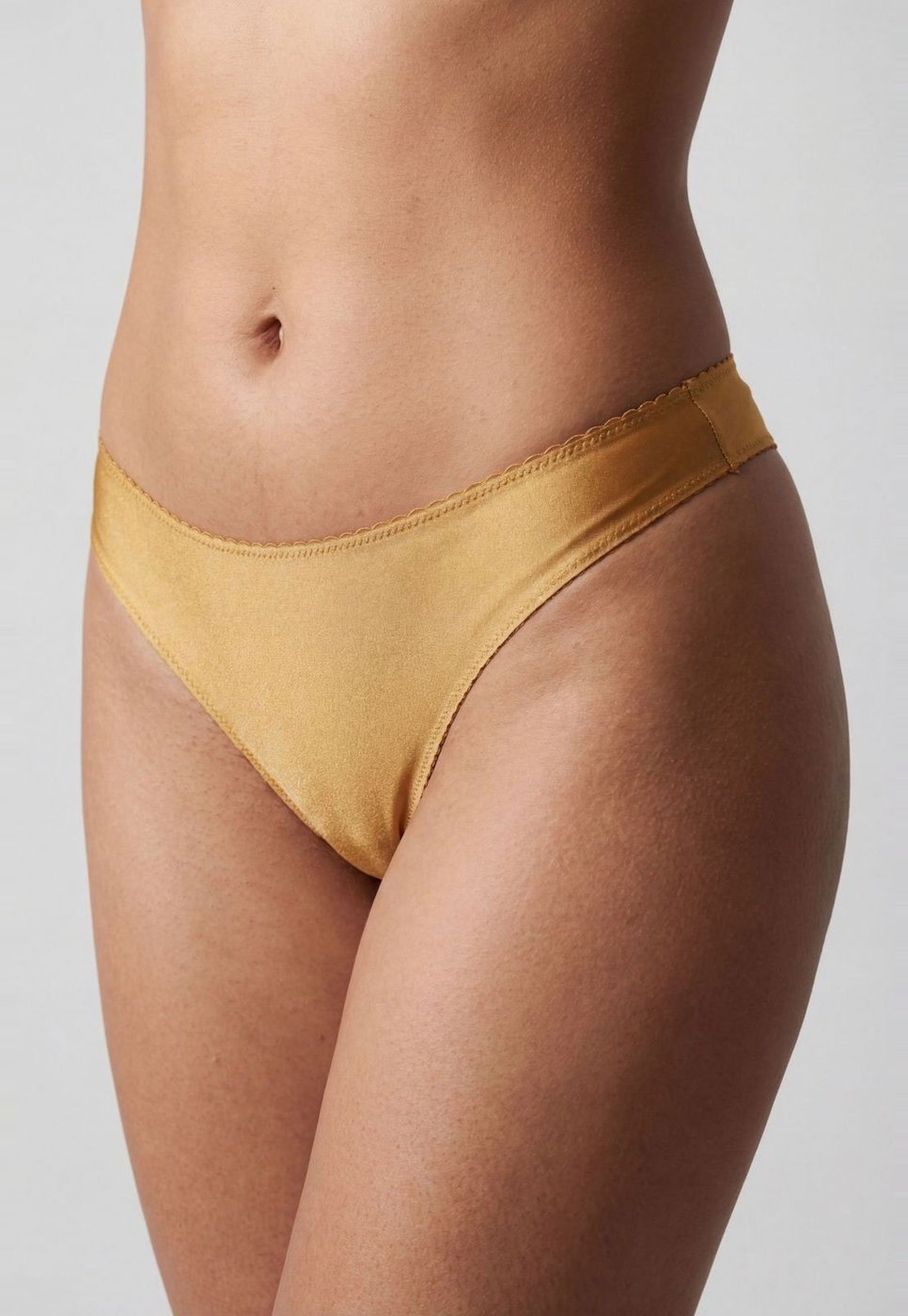 Imagem principal Calcinha Fio Dental Hope Acabamento Invisível Dourada dourado Hope dourado