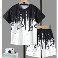 Boys' Summer Set: Cool Black & White Round-neck T-shirt with Slanted Pocket, Paired with Matching Shorts for Casual Play.