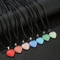 5Pcs A glow-in-the-dark heart-shaped necklace set, featuring a luminous charm and an adjustable leather necklace cord.