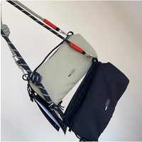 AliExpress NONE Fashionable niche outdoor cycling backpack, ultra lightweight, carrying sports crossbody bag, trendy brand for men